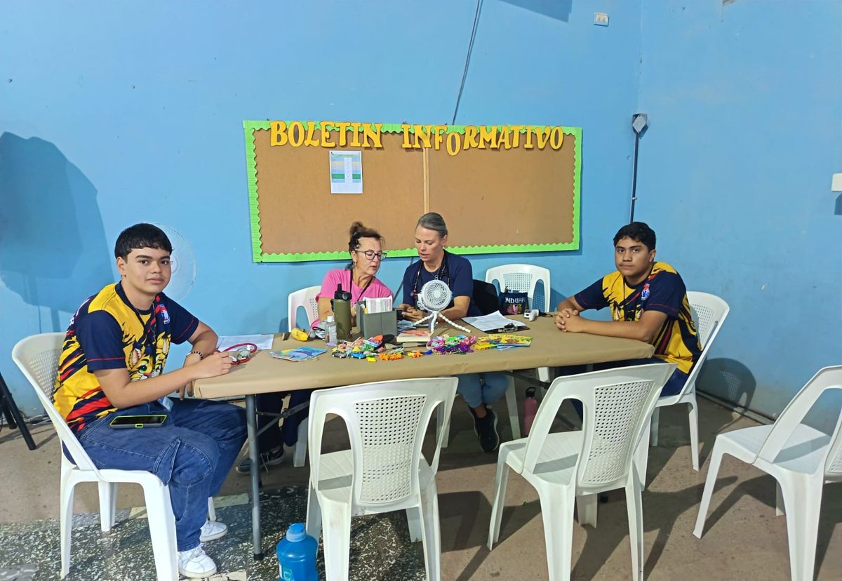 Coral students translating at a consultation table